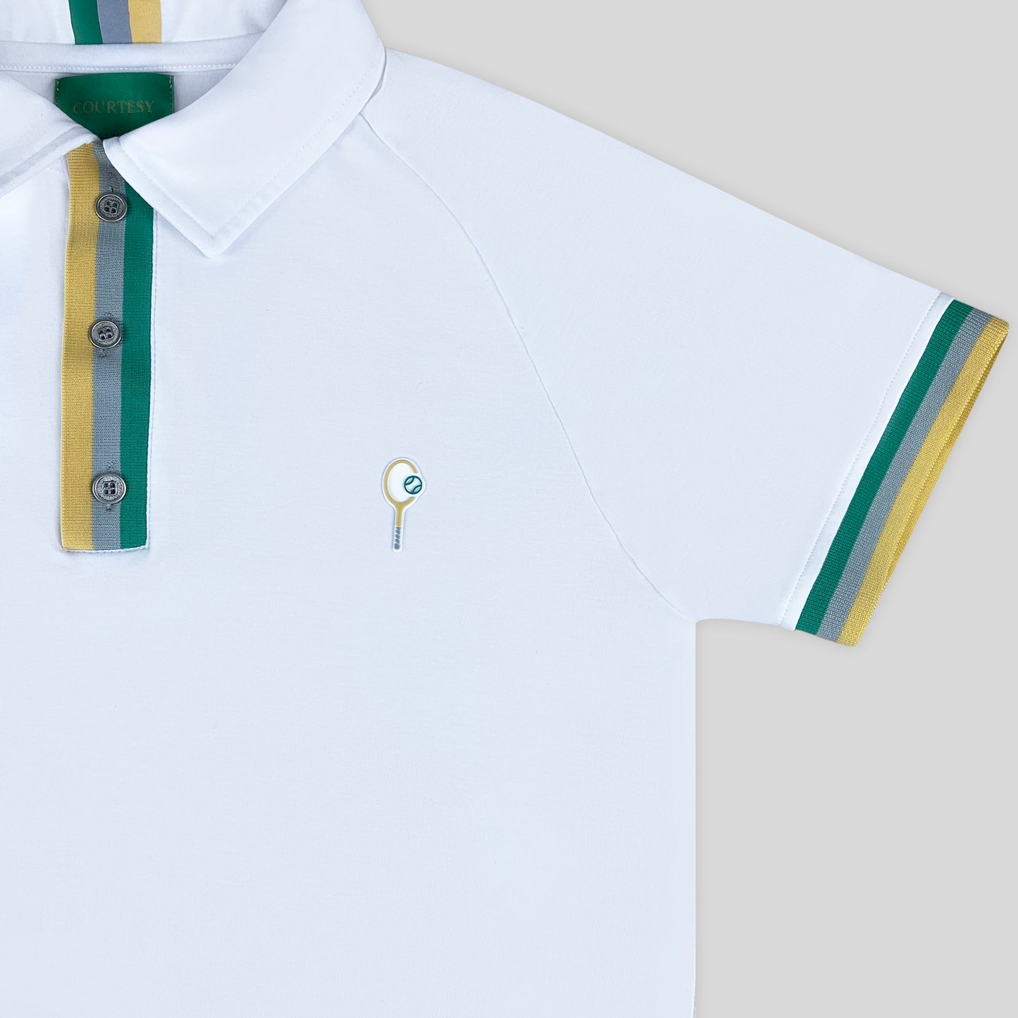 Courtesy Attire (The Courtesy Polo) racket sports/tennis clothing. All white activewear.